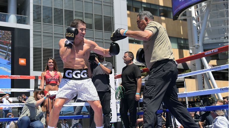 Golovkin works the pads with trainer Abel Sanchez at the public workout
