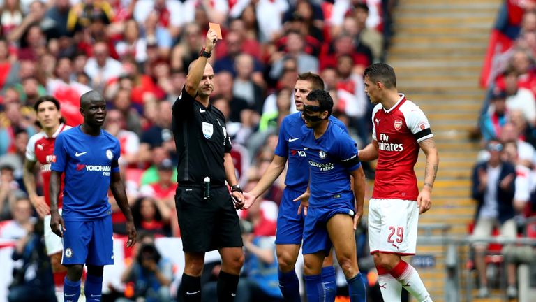 Referee Bobby Madley issues a straight red card to Chelsea forward Pedro
