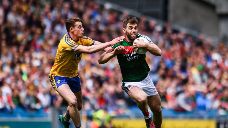 Seamus O'Shea of Mayo is tackled by Roscommon's Niall McInerney