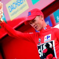 Christopher Froome celebrates after retaining the red jersey