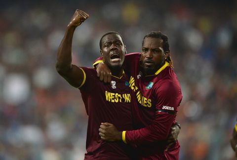 Carlos Brathwaite (L) and Chris Gayle after dismissing Joe Root