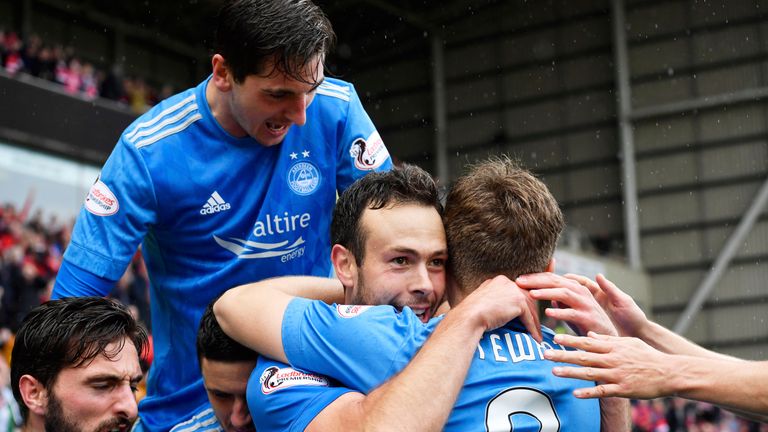 Aberdeen's Andy Considine (centre) savours his decisive intervention at Fir Park