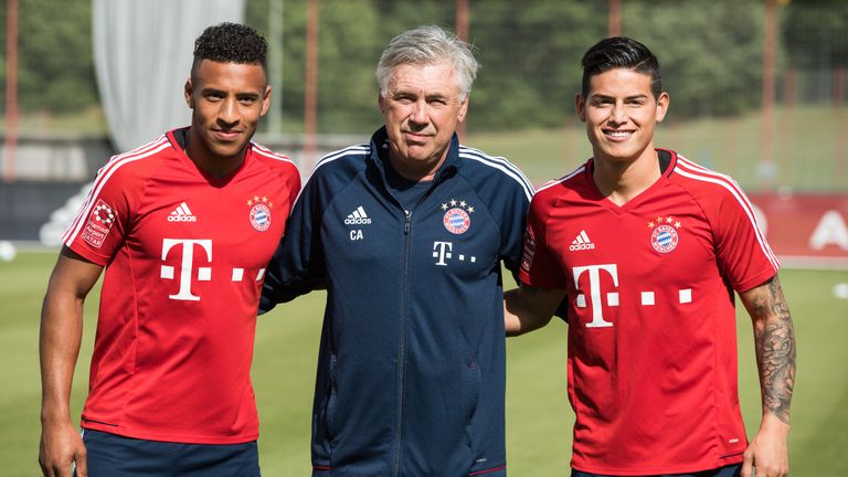 Ancelotti poses with Corentin Tolisso and James Rodriguez as Bayern boss