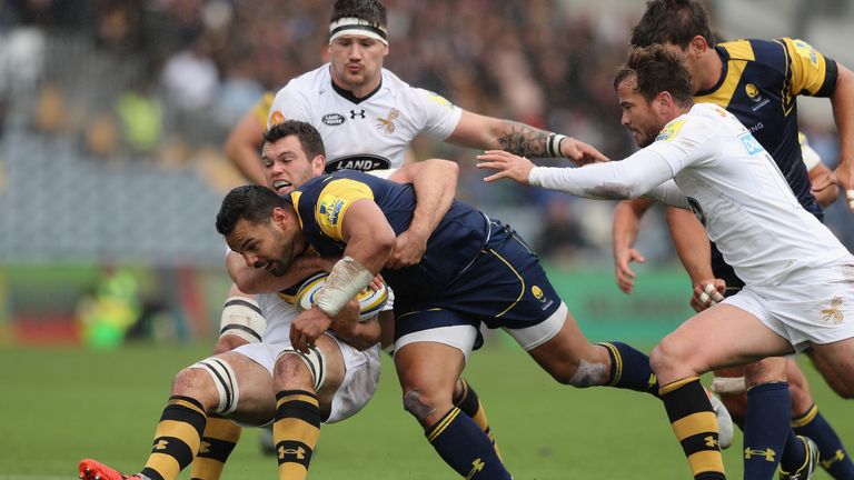  Worcester's Ben Te'o is tackled by Wasps' Alex Rieder 