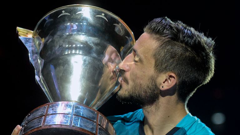 Damir Dzumhur celebrates with the trophy after winning his first ATP title at the St. Petersburg Open