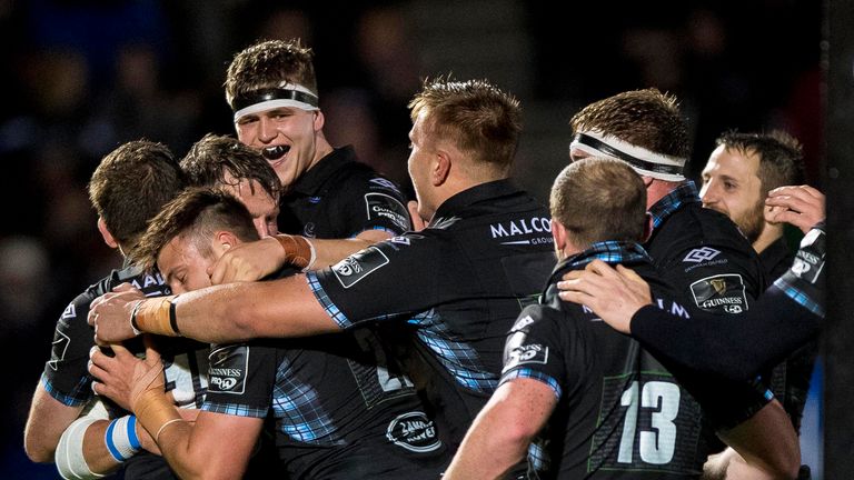 Warriors' Peter Horne celebrates scoring a try with teammates