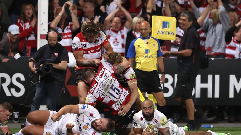 Gloucester celebrate after Jason Woodward scores a last minute winning try over champions Exeter