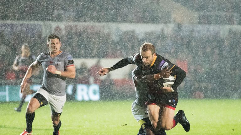 Dragons' Sarel Pretorius is tackled by Southern Kings' Masixole Banda