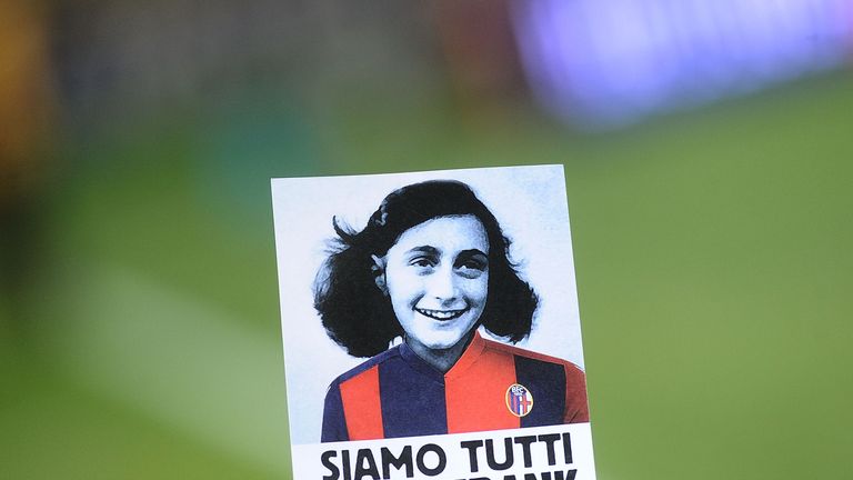 A sticker with the image of Anna Frank wearing the jersey of Bologna FC that says 'we are all Anne Frank'