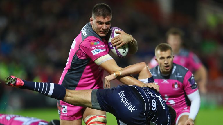 Jake Polledri (L) of Gloucester powers past Clement Martinez of Agen 