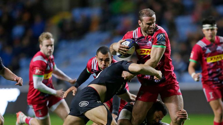 Jamie Roberts is tackled by Jimmy Gopperth 