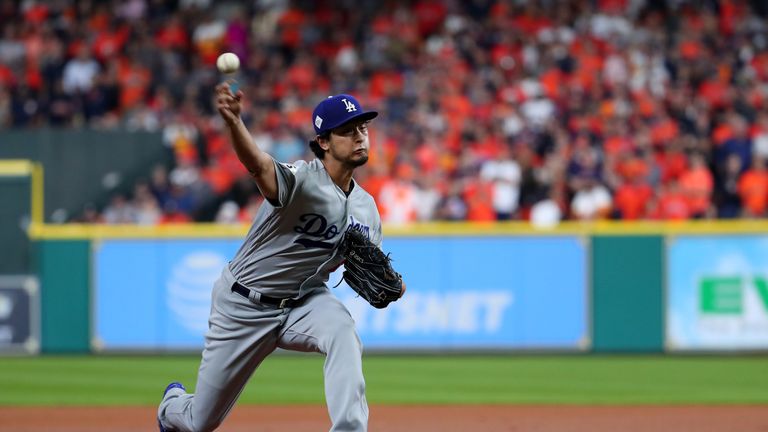 Los Angeles Dodgers' Yu Darvish throws a pitch during the first inning against the Houston Astros