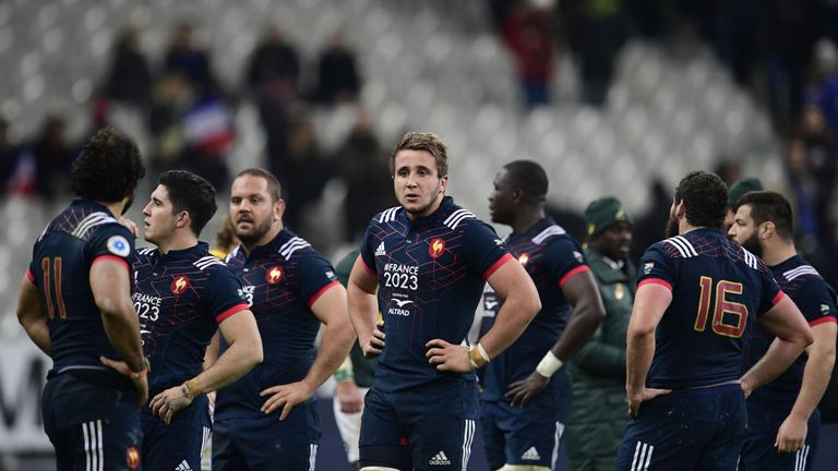 France's players react after defeat in the Test match against South Africa's at the Stade de France