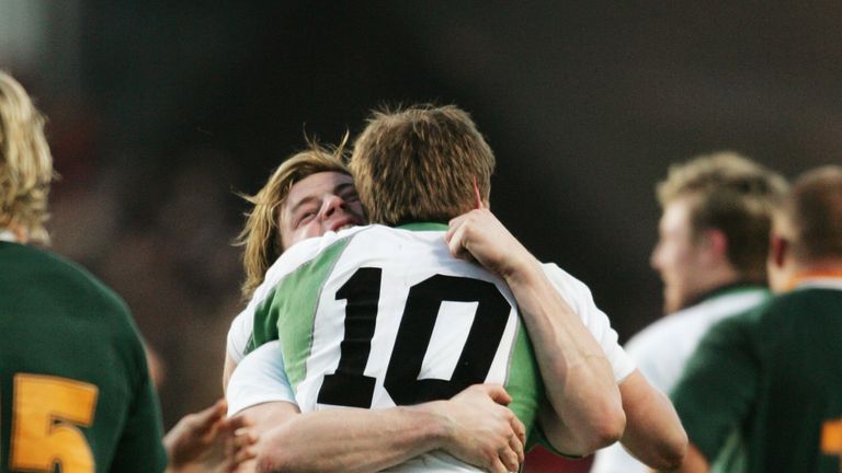 Brian O'Driscoll hugs Ronan O'Gara after the final whistle in 2004
