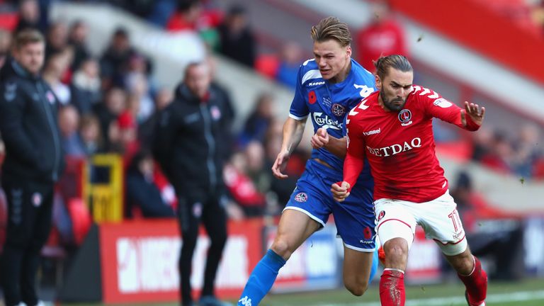 Ricky Holmes of Charlton (R) and Cody Cooke of Truro City during the FA Cup first round match