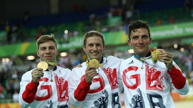 Callum Skinner (r) with Philip Hindes and Jason Kenny after winning Olympic gold in the team sprint at Rio 2016