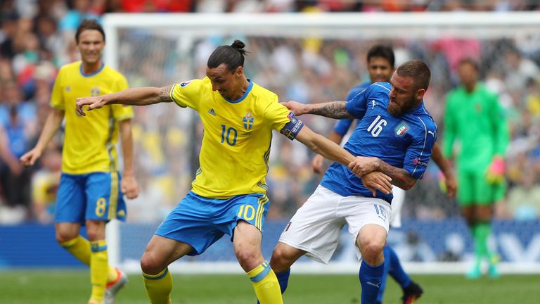 Zlatan Ibrahimovic holds off pressure from Daniele De Rossi of Italy during Euro 2016