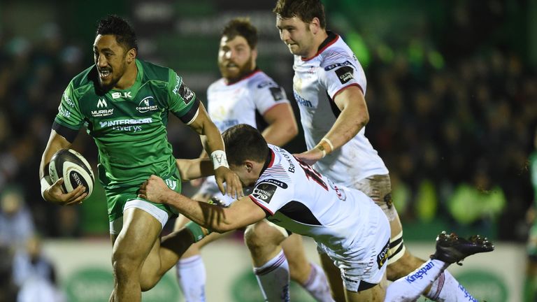 Connacht's Bundee Aki evades Jacob Stockdale on his way to scoring