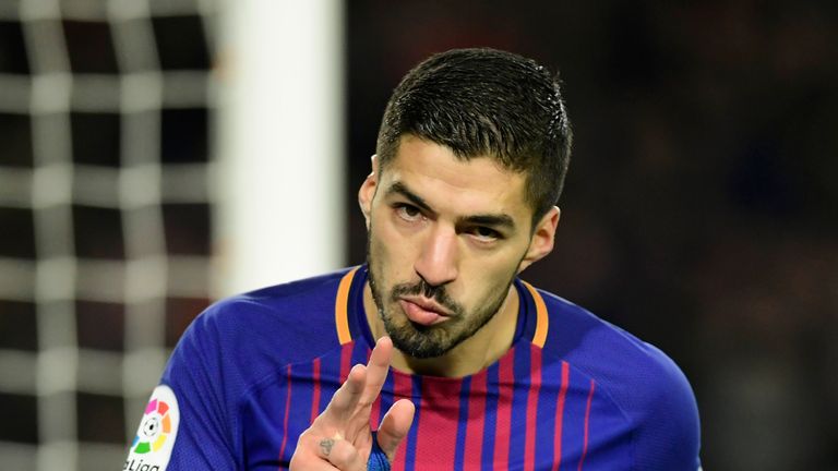 Luis Suarez celebrates after scoring his second goal