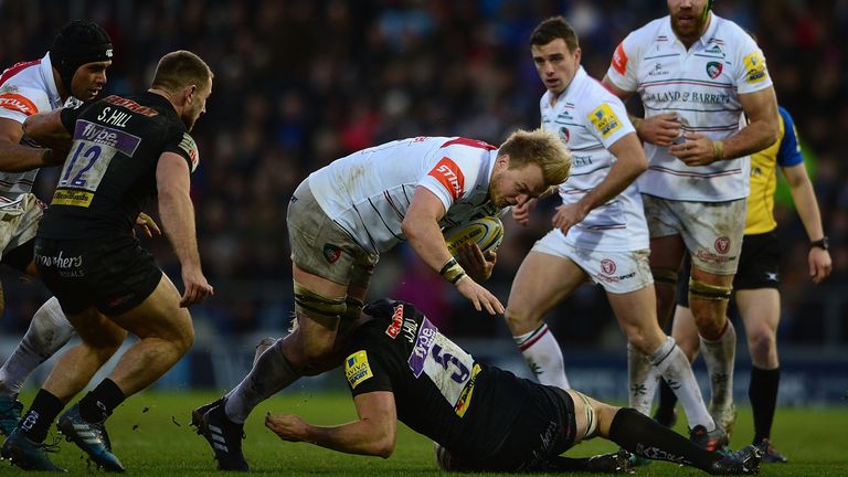 Luke Hamilton of Leicester is tackled by Jonny Hill of Exeter