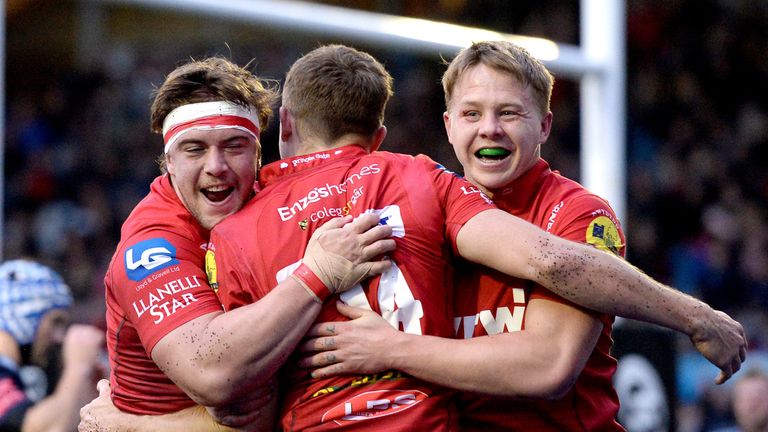 Tom Prydie celebrates celebrates with team-mates after scoring the first try of the game