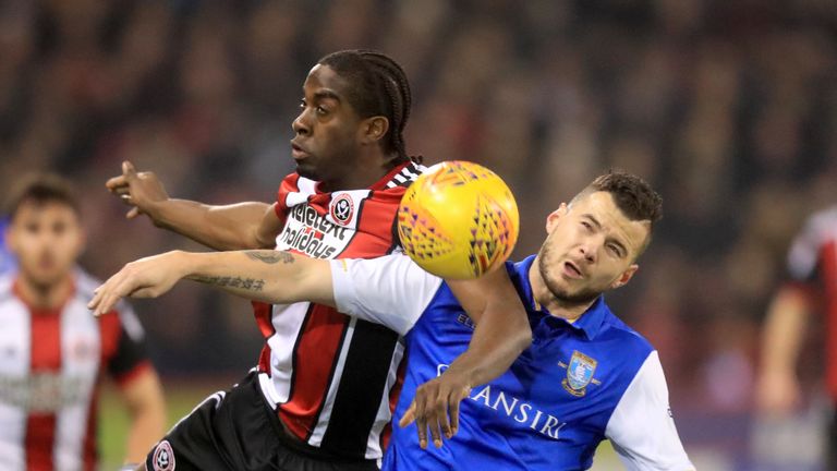 Daniel Pudil (right) and Clayton Donaldson battle for the ball