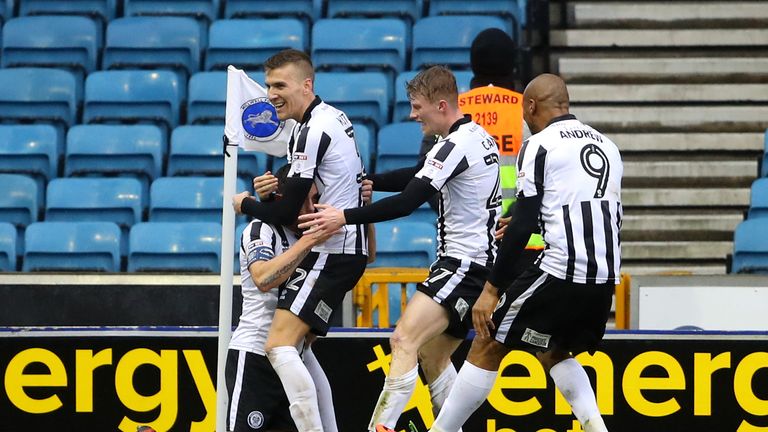 Ian Henderson celebrates scoring for Rochdale at The Den