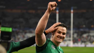 Johnny Sexton salutes the Irish fans after dropping a long-range goal to win the match at the Stade de France