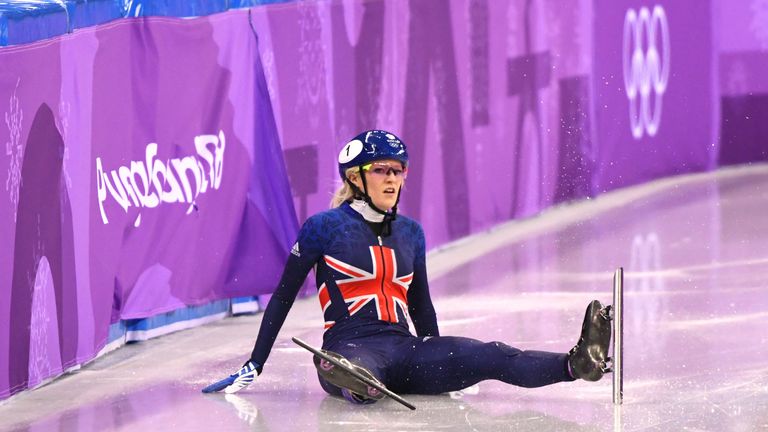 Christie looks on after crashing out of the 500m short track final