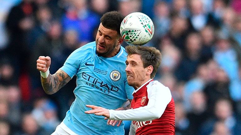 Kyle Walker and Nacho Monreal battle during the first half