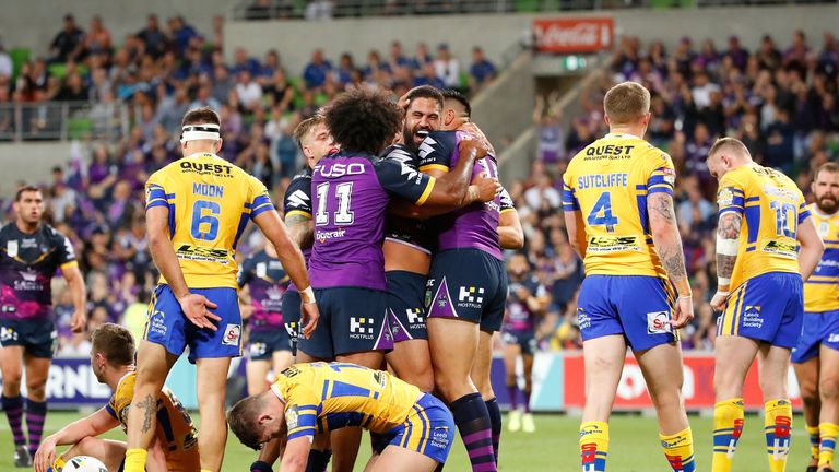 Melbourne's Jesse Bromwich is congratulated by his team-mates after scoring a try during the World Club Challenge match