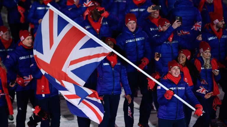 Lizzy Yarnold carries the flag for the Great Britain team at the opening ceremony 