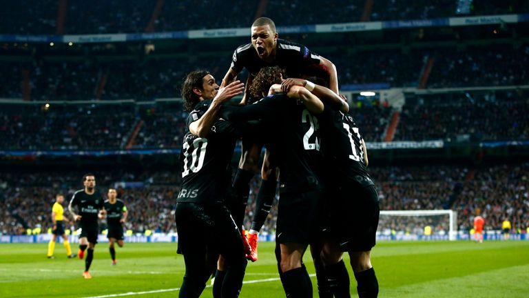 PSG's players celebrate their late equaliser
