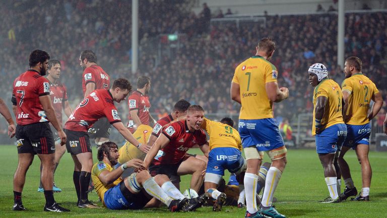 Jack Goodhue celebrates one of his two tries against the Blues