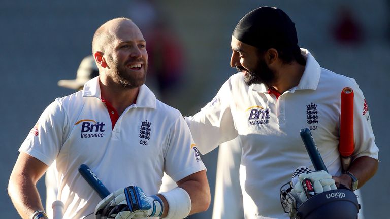 Matt Prior and Monty Panesar celebrate after holding on for a famous draw at Auckland
