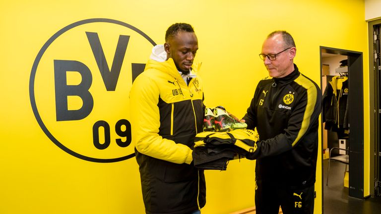 Bolt receives his training gear from Borussia Dortmund kit manager Frank Graefen