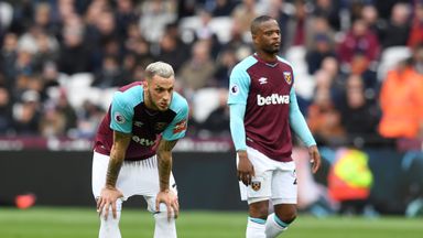 Image of Marko Arnautovic and Patrice Evra look on during West Ham's 4-1 defeat to Man City
