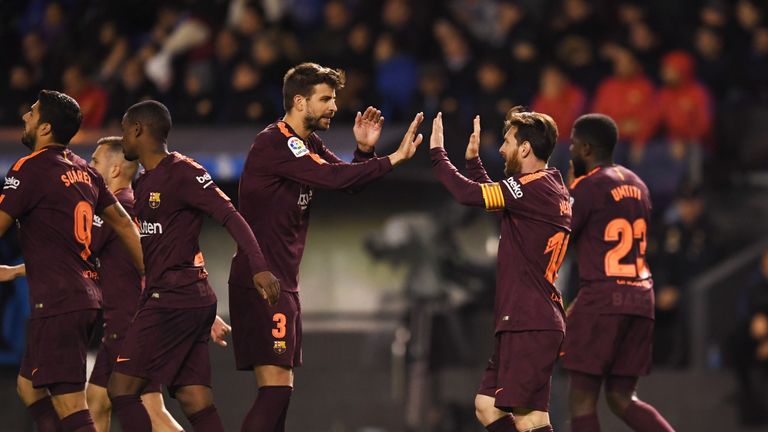 Lionel Messi celebrates with Gerard Pique during Barcelona's 4-2 win over Deportivo