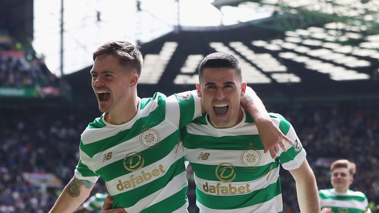 Tomas Rogic celebrates with Mikael Lustig after scoring Celtic's fourth goal