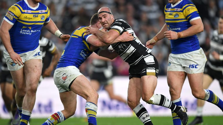 Danny Houghton is tackled by Parcell 