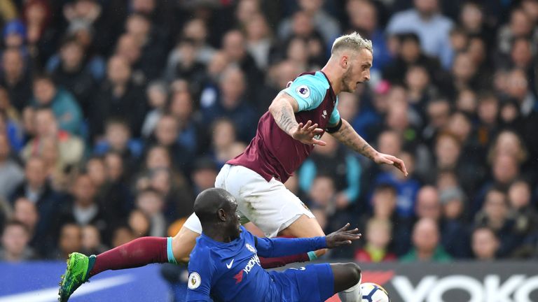 Marko Arnautovic is tackled by N'Golo Kante