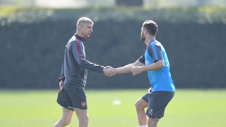 Wenger greets Mustafi at training after announcing he is set to leave