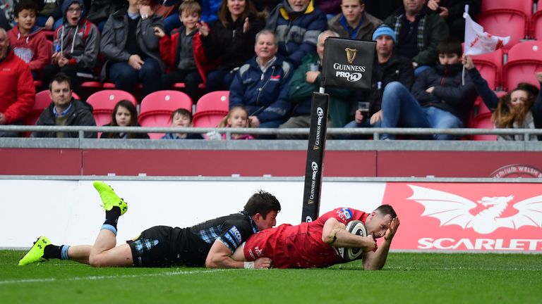 Gareth Davies of Scarlets finishes in the corner after breaking from an intercept to score from 55 metres