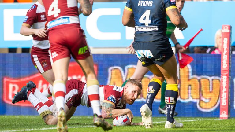 Sam Tomkins touches down for a try against Warrington.
