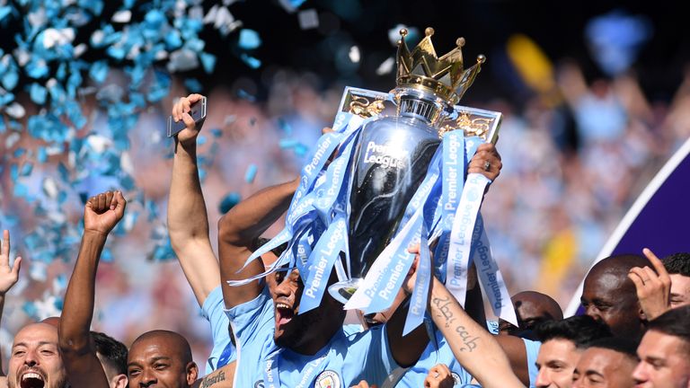 Vincent Kompany lifts last season's Premier League trophy
