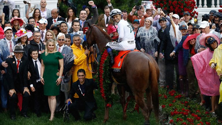 Jockey Mike Smith poses for a photo in the winner's circle atop of Justify #7 after winning the 144th running of the Kentucky Derby