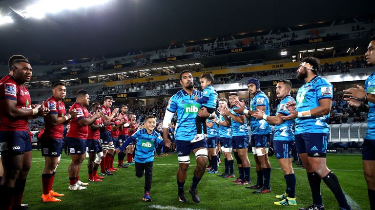 The Blues and Reds form a guard of honour for Jerome Kaino at Eden Park