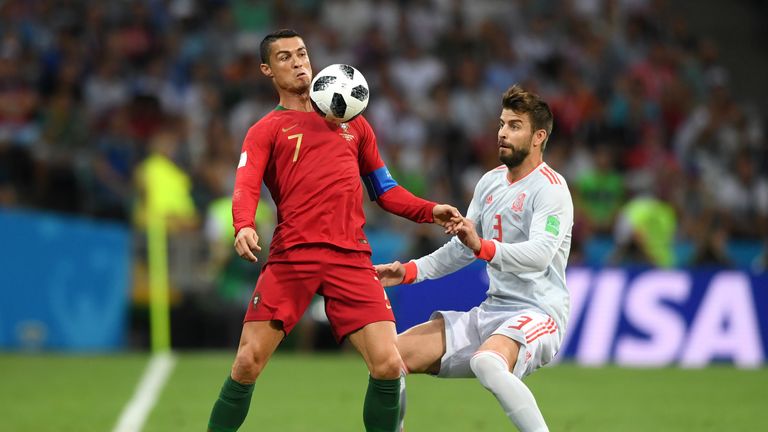 Ronaldo is challenged by Gerard Pique