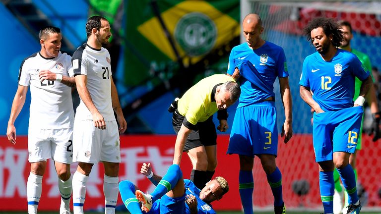 Referee Bjorn Kuipers checks on Brazil's forward Neymar