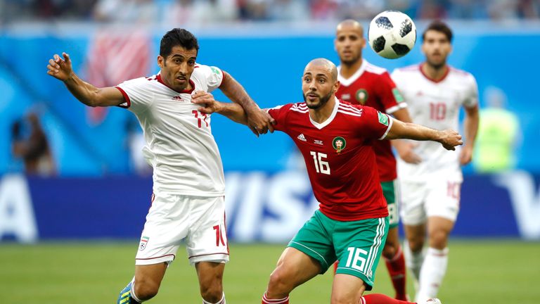 Vahid Amiri and Noureddine Amrabat in action during the 2018 World Cup Group B match between Morocco and Iran
